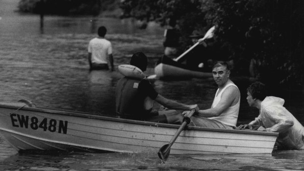 At Lane Cove residents use boats to evacuate their flooded homes.