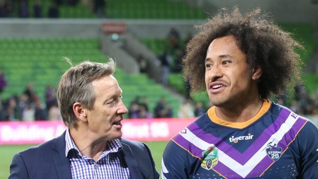 Craig Bellamy with Felise Kaufusi after Storm's one-point qualifying final win over South Sydney on Friday night.