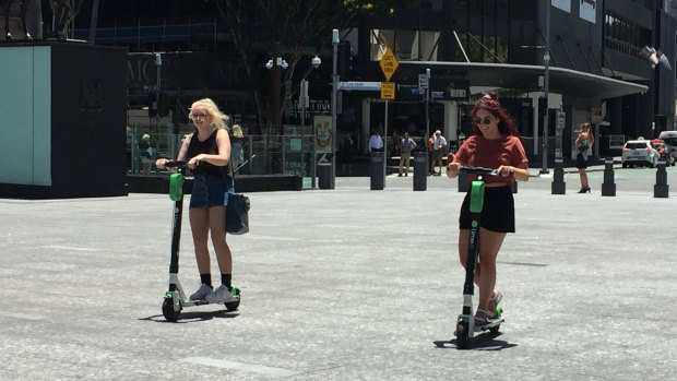 Lime scooter riders risk brain injury and death while zipping around without helmets on in Brisbane city.