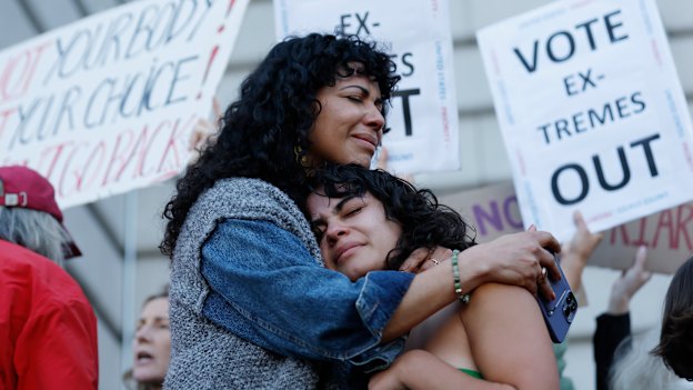 Mitzi Rivas, left, hugs her daughter Maya Iribarren during an abortion-rights protest at City Hall in San Francisco following the Supreme Court’s decision to overturn Roe v Wade.