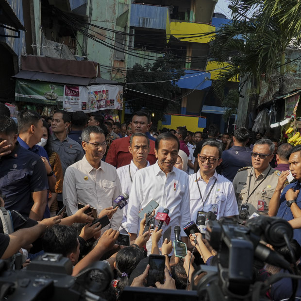 Jokowi, as he is widely known, fronts a local media pack during a visit to Pal Merah traditional market in Jakarta, Indonesia.