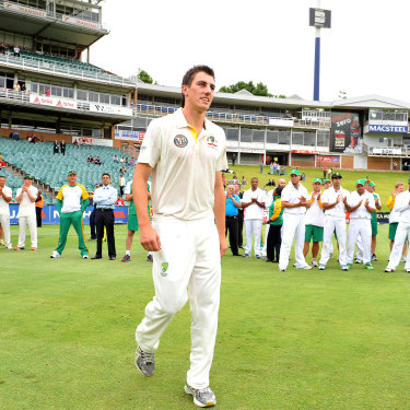 Cummins winning the man of the match award on his Test debut, against South Africa in 2011.