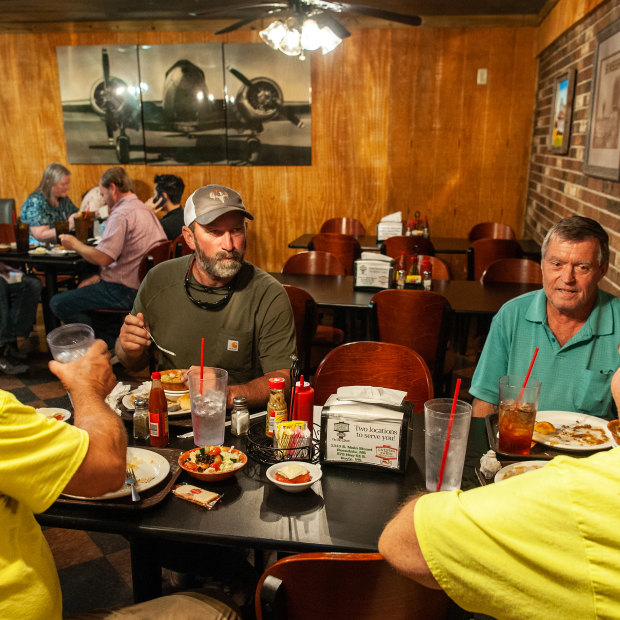 Left to right: Mitch Reginelli, Bruce Craig, Nicholas Kovach and James Lemonis gather for lunch at Catfish Cabin in Boyle, Mississippi: “haven’t run into the vaccinator yet”.