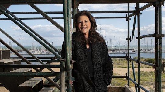Patricia Ilhan among the scaffolding of her new home.