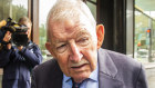 Ron Brierley, seen outside Sydney's Downing Street Local Court, was arrested in December at Sydney International Airport after being searched while boarding a plane.