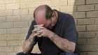 A man prays outside a medical centre in Odessa, Texas.