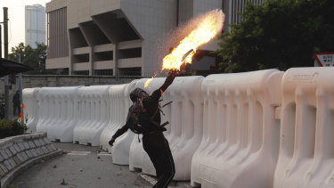 You won't see this on TikTok: An anti-government protester throws a Molotov cocktail during a protest in Hong Kong.