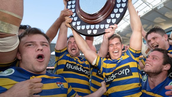 Champs again: Sydney University celebrate back-to-back titles after a come-from-behind win over Warringah.