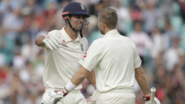Congrats: Joe Root (right) celebrates his own century with Cook.