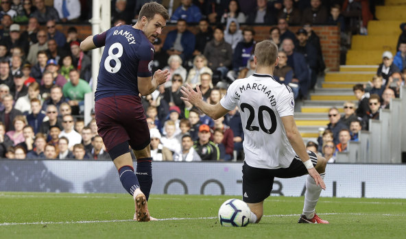 Arsenal's Aaron Ramsey scores his side's third goal against Fulham at Craven Cottage on Sunday.
