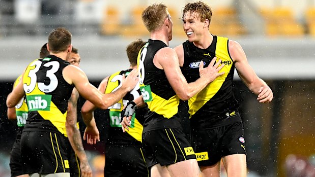 Lynch mob: Richmond players celebrate after key forward Tom Lynch kicks a major.