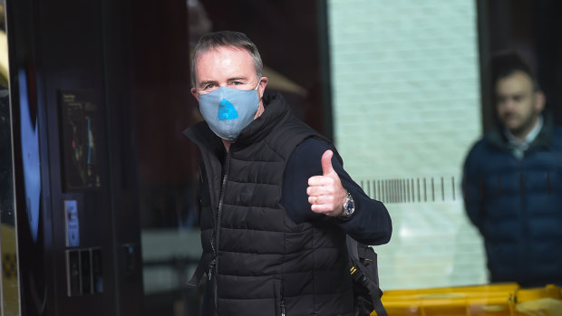 Patrick Enright leaves hotel quarantine in June. 