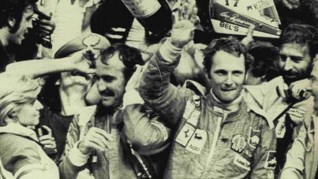 Niki Lauda waves to the crowd after being crowd world champion in 1975.