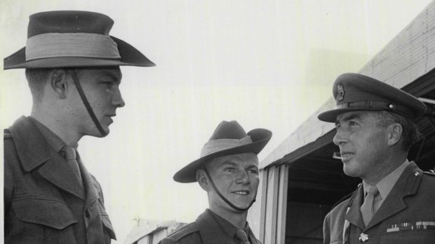 David Roubin (left) and another national serviceman are met by a colonel at the start of a course at north-west Sydney's Scheyville Officer Training Unit.