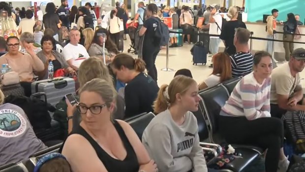 Long delays at the Gold Coast Airport as an outage has affected the check in systems.