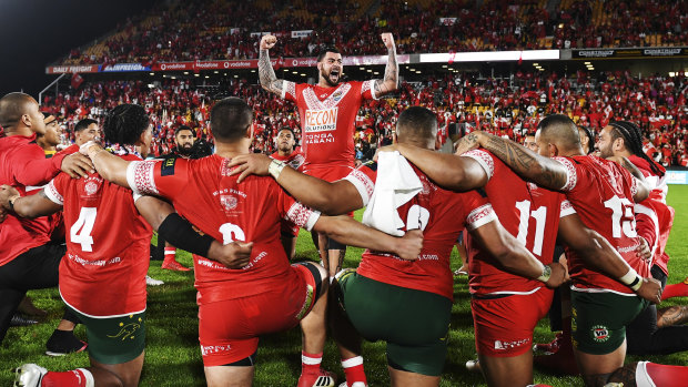 Passion and pride: Andrew Fifita leads the Tongans in a rendition of the Sipi Tau on Saturday night.