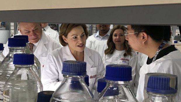 Deputy Premier Jackie Trad inspects the Griffith University lab where the spinal repair research is taking place.