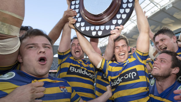 Champs again: Sydney University celebrate back-to-back titles after a come-from-behind win over Warringah.