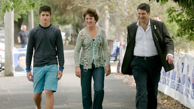 Nick Bracks with his parents in 2006.