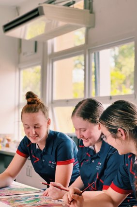 Toowoomba State High School students work in a newly air-conditioned classroom.