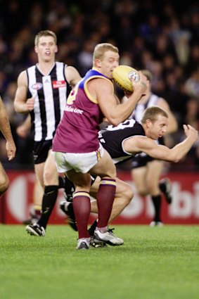 Michael Voss gathers in the ball.