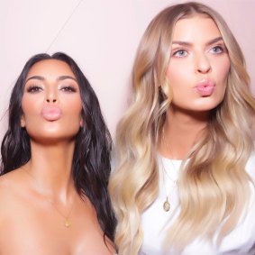 Kim Kardashian and Elle Ferguson at a KKW Beauty launch in 2017.