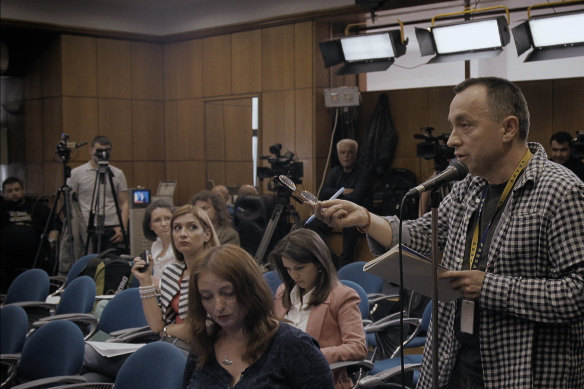 Sports Gazette editor Catalin Tolontan questions the Romanian Health Ministry in a scene from Alexander Nanau’s documentary Collective. 