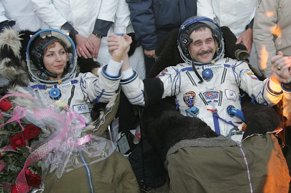Ansari became the first woman in space, and traveled alongside Russian cosmonaut Pavel Vinogradov (right) and American astronaut Geoffrey Williams.