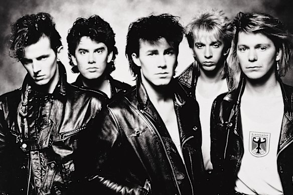 Valentine with models (back, second from left).