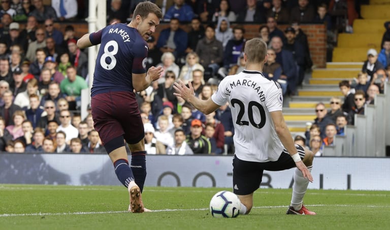 Arsenal's Aaron Ramsey scores his side's third goal against Fulham at Craven Cottage on Sunday.