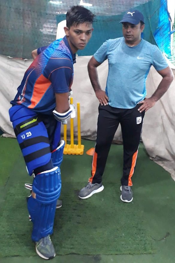 Jwala Singh coaching a young Jaiswal.