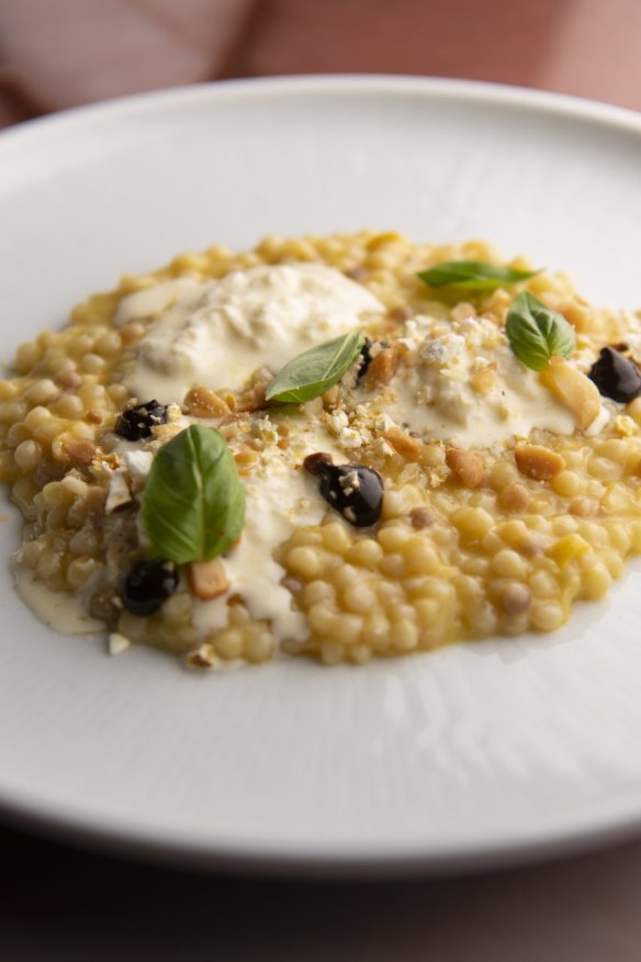 Fregola, corn, black garlic, stracciatella. 