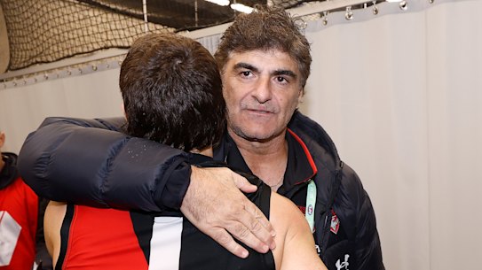 Adrian Dodoro hugs number one draft pick Andrew McGrath after a match earlier this season