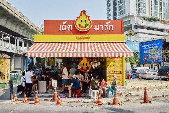 Street stall Phed Mark in Bangkok specialises in pad krapao (holy basil stir-fry), a Thai staple.