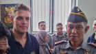Bali Nine member Matthew Norman chatting with Indonesian politicians in Kerobokan Prison on Friday.