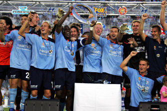 Dwight Yorke leads the celebration for Sydney FC after they won the inaugural A-League title in 2005.