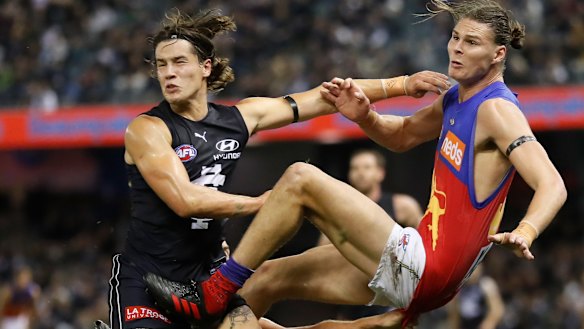 Bump and grind: Lion Eric Hipwood is tackled.