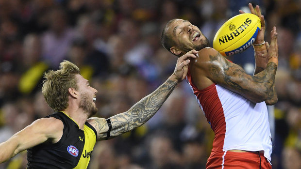 Nathan Broad attempts to spoil Sydney's Lance Franklin.
