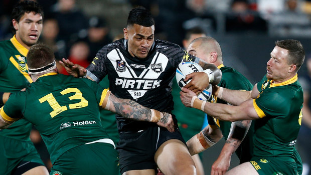 Out of my way: Ken Maumalo makes a run at the Australian defence.