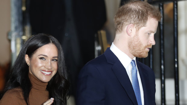 Britain's Prince Harry and Meghan, Duchess of Sussex, leave after visiting Canada House in London.