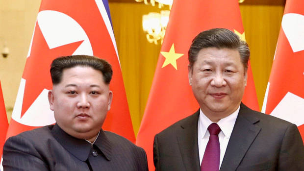North Korean leader Kim Jong-un, left, and Chinese President Xi Jinping poses for a photo in Beijing in 2018.