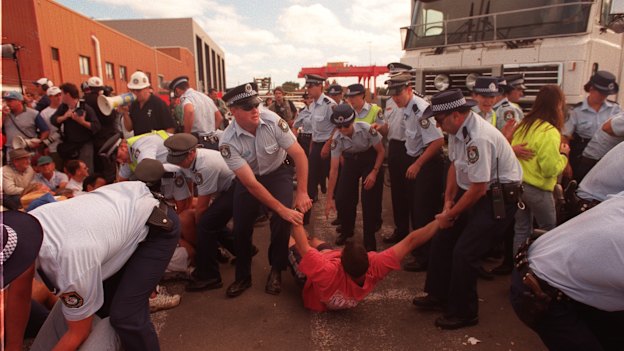 Police move protesters off the picket line at Patrick.