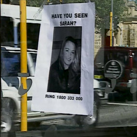 A missing poster on the public phone booth where Sarah Spiers called for a taxi before she vanished. 