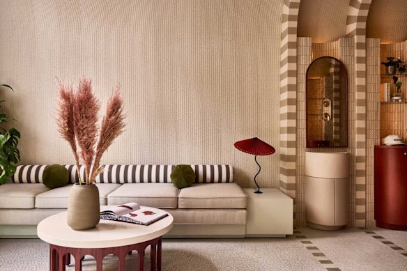 The lobby, which was designed by Islyn Studio, draws inspiration from vintage train cars and Japanese capsule hotels.