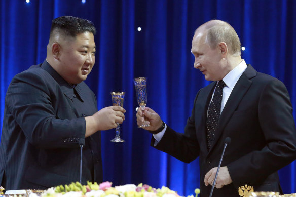 North Korean leader Kim Jong Un raises a toast with Russian President Vladimir Putin.