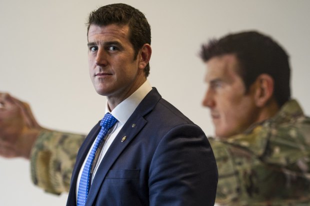 Ben Roberts-Smith in front of his portrait at the Australian War Memorial in Canberra.