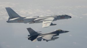 A Taiwan Air Force F-16 fighter jet flies alongside a Chinese H-6K bomber during an earlier incursion.