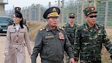 Kim Yo Jong,  left, the sister of North Korean leader Kim Jong Un, visits frontline areas, with military officials, in North Korea on Thursday, October 22.