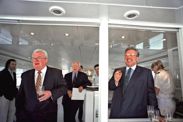 Graham Richardson (left) and Rene Rivkin during the launch of the latter’s newsletter aboard his boat in 2006.