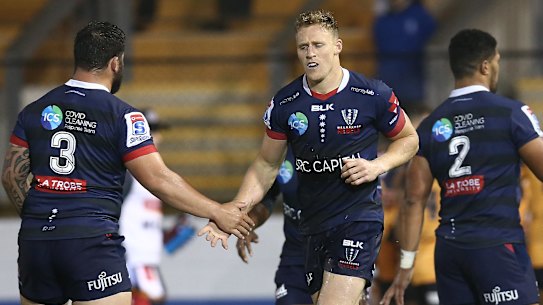 YDNEY, AUSTRALIA - AUGUST 07: Reece Hodge of the Rebels celebrates scoring a try during the round 6 Super Rugby AU match between the Rebels and Brumbies at Leichhardt Oval on August 07, 2020 in Sydney, Australia. (Photo by Jason McCawley/Getty Images)